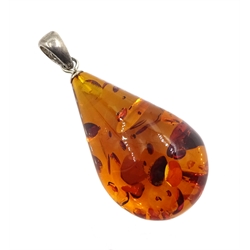 Silver amber boat pendant necklace, one other green amber boat pendant, amber pendant and silver stone set bracelet, all stamped 925 (4)