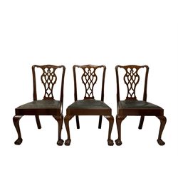 Set six (2+4) Chippendale style dining chairs, the shaped cresting rail over pierced splat over drop in seat pads, raised on ball and claw supports  