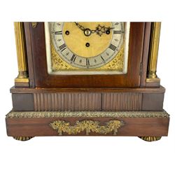 Webber of Liverpool - late 19th century English 8-day walnut bracket clock in a break arch case with brass finials and brass inlay to the tympanum, silk backed side frets with brass spandrels and reeded brass columns to the front, on a double rectangular plinth raised on brass feet,  with an arched brass dial, silvered chapter ring, Roman numerals and pierced steel hands with conforming subsidiary dials for pendulum regulation, chime/silent and chime selection,  substantial three train chain driven fusee movement sounding the quarters on 8-bells and the hours on a coiled gong. With pendulum and key.
