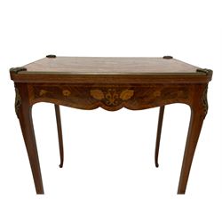 Mid-20th century Kingwood and rosewood card or games table, the rectangular top with rounded corners inlaid with shaped panels and extending floral decoration, swivel and folding action revealing baize lined playing surface, decorated with cast metal corner cartouches and brass mouldings, fitted with single end drawer, shaped frieze rails with further inlay, on cabriole supports 