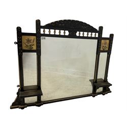 Art Nouveau overmantle triple mirror, the ebonised frame carved with foliate decoration, the scalloped pediment over gilt spindle frize flanked by painted lily panels, chamfered uprights with carved detail