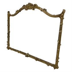 Regency design gilt framed overmantle mirror, pierced shell pediment with foliate and flower head extending decoration