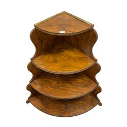 Mid-to late19th century walnut corner three tier etagere, with swept and shaped uprights 