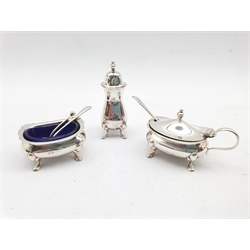 Silver three piece condiment set with blue glass liners and three various spoons Birmingham 1923 Maker William Suckling Ltd 
