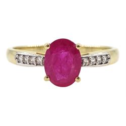 9ct gold single stone oval ruby ring, with cubic zirconia set shoulders, hallmarked 