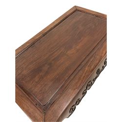 Chinese hardwood coffee table, the rectangular top and moulded edge over shaped apron, raised on scrolled supports 
