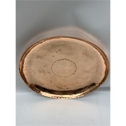 Newlyn copper tray, of circular form with scalloped rim and hammered surface, stamped D29cm 