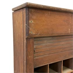 19th century oak hotel or post office pigeonhole cabinet, rectangular walnut top over twenty four pigeonholes enclosed by pitch pine tambour roll door
Provenance: from the property of the old Ambassador Hotel York