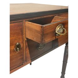 19th century mahogany side table, the rectangular top with reeded edge over two short drawers and two cupboard doors, flanked by two campaign handles, raised on turned supports 