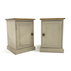 Pair of painted pine bedside cupboards, with panelled door enclosing single shelf, W40cm, H57cm, D40cm