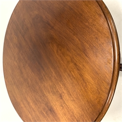 Victorian mahogany breakfast table, circular moulded tilt top on turned pedestal, four shaped out splayed supports with scroll carved terminals, brass and ceramic castors, D119cm, H74cm