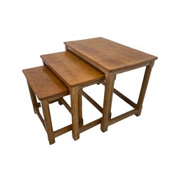 
'Mouseman' oak nest of three tables, rectangular adzed tops, each table carved with mouse signature, by Robert Thompson of Kilburn