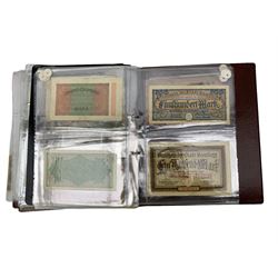 Great British and World banknotes, including Bank of England Page one pound 'ES41', various The Japanese Government banknotes, Queen Elizabeth II East Caribbean Currency Authority one dollar 'B69 706721', various Chinese banknotes etc, housed in a folder
