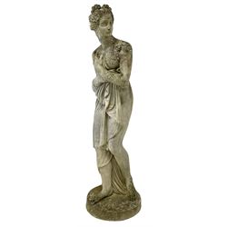 Weathered composite stone garden statue in the form of a classically draped female modelled as Venus Italica after Antonio Canova