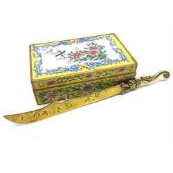 19th century Canton rectangular enamel box, the hinged cover painted with birds perched on a branch within a Dog of Fo and flaming pearl border, L16cm, together with a Chinese brass paper knife (2)