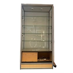 Tall display cabinet, fitted with two glazed sliding doors with glazed sides and back, interior light fittings, with adjustable glass shelves