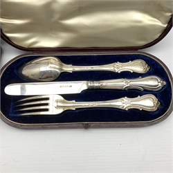 Cased pair of silver sauce ladles London 1923 Maker Josiah Williams & Co., and a Victorian silver three piece christening set of knife, fork and spoon with inscription, cased Sheffield 1850 Maker Aaron Hadfield 10oz