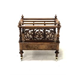 Victorian figured mahogany Canterbury, with turned finials, string inlay, floral fretwork decoration, single drawer, raised on turned supports terminating in brass cup and ceramic castors 