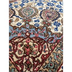 Tabriz cream ground rug, decorated in floral motifs with repeating floral borders 272cm x 170cm