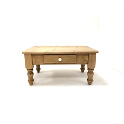 Contemporary pine coffee table fitted with one drawer and raised on turned supports