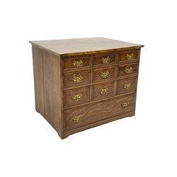 18th century style oak chest of drawers , fitted with nine small and one long drawer, raised on bracket supports with recessed castors W89cm, H76cm, D68c