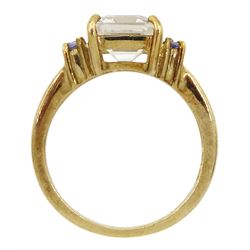 9ct gold white topaz ring, each side set with two round tanzanites, hallmarked
