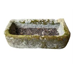 19th century tooled and weathered stone trough or planter, D-shaped form with shallow hewn centre