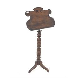 Late Victorian pitch pine music Stand, the shaped telescopic top with ebonised inlaid initials 'A.O' raised on turned upright and three splayed supports, reputedly made in Settle, N Yorkshire C. 1880
