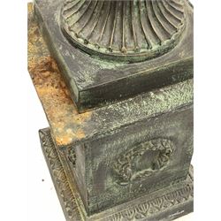 Classical design cast iron urn, lobe moulded rim over body decorated with stylised foliate, over fluted socle and square base, raised on a stepped square plinth, H112cm
