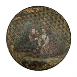 19th century papier mache circular snuff box, the cover painted with a young couple against cross-hatched and scroll gilt ground, the interior cover initialled W.H, D8.5cm