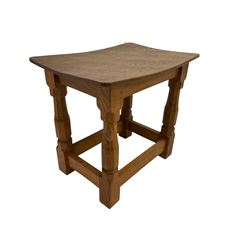 Mouseman - adzed oak joint stool, dished top on four octagonal supports united by stretchers, carved with mouse signature, by the workshop of Robert Thompson, Kilburn