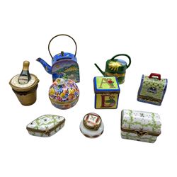 Porcelain and enamel trinket boxes comprising an Empress Arts teapot, three by Limoges 'Dubarry', champagne bucket, Herend reticulated box and cover and three others by Limoges (9)