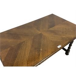Mid-20th century oak draw leaf extending dining table, rectangular moulded top with quarter-matched veneers, two end leaves, on turned supports united by moulded H stretchers 