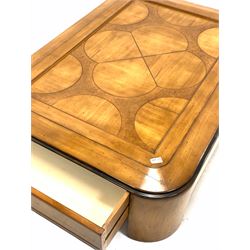 Art Deco style walnut coffee table, the panelled top with incised carved decoration over drawer to each end, raised on quarter round supports 128cm x 92cm, H37cm