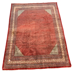 Large Persian Araak carpet, red ground field decorated all over with Boteh motifs, multiple band border, 420cm x 319cm