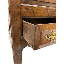 Georgian oak mule chest, the hinged lifting lid and two drawers over shaped apron, raised on stile supports 
