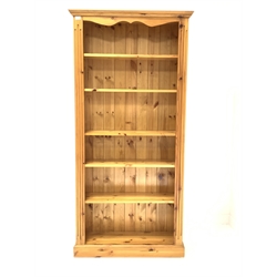  Solid pine open bookcase with fluted decoration enclosing five adjustable shelves, W89cm, H183cm, D29cm   