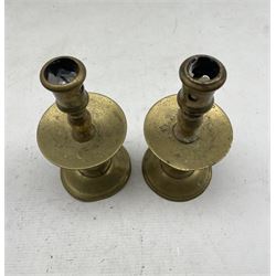 A matching pair of brass Heemskerk type candlesticks with mid drip trays, pierced sockets and baluster stems, H20cm 