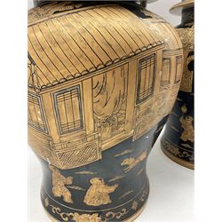 Pair of 20th century Chinese baluster jars with covers, gold on black ground depicting boys at play with lanterns marked on base H49cm (2)