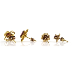Pair of gold oval garnet stud earrings, open work design and one other similar pair, both 9ct stamped or tested