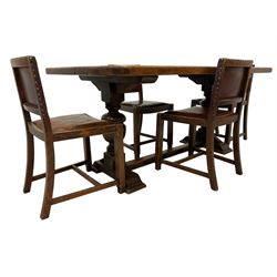 20th century oak dining table, rectangular top on turned pedestal supports, sledge feet joined by floor stretcher, and set four oak chairs