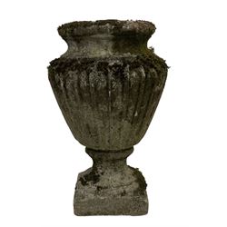 Weathered cast stone garden urn, tapered form on circular foot and square base (H44cm); together with a circular plater (D35cm)