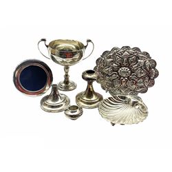 Silver two handled challenge cup with Masonic presentation inscription 'Neasden Lodge' H13cm London 1934 7.6oz, silver shell shape butter dish, modern small silver photograph frame, pair of small silver candlesticks and an oval mirror in Continental 900 standard frame
