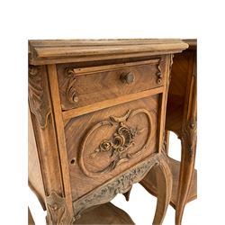 Pair early 20th century French walnut bedside pot cupboards, marble top in moulded edge over drawer and cupboard, the cupboard with lined interior, cabriole supports united by under-tier, carved with shell and floral motifs  