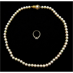 Single strand cultured pearl necklace, with gold clasp stamped 14K and a 9ct gold single stone diamond ring, illusion set