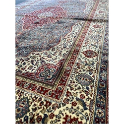 Kashmir full pile rug, with traditional floral medallion on duck egg blue field with ivory spandrels enclosed by guarded border 