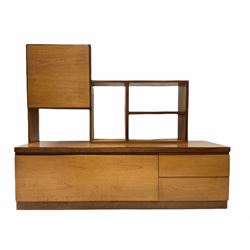 Mid century Danish design teak modular low-line wall unit, the raised back with cupboard and open shelves, fall front cupboard and two drawers to base 