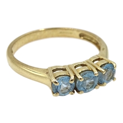 9ct gold three stone blue topaz ring, hallmarked