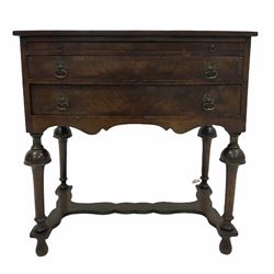 Early 20th century Queen Anne style cross banded bow front walnut writing table with slide and two drawers over shaped apron, raised on turned supports United by shaped stretcher 
