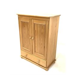 Solid pine tallboy, fitted with a  double cupboard over single drawer, raised on bun supports W89cm, H120cm, D45cm